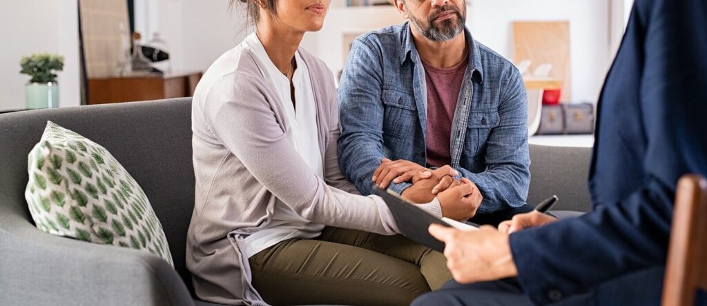 A couple attending marriage counseling with a couples therapist. Marriage counseling in American Fork, UT is here for you. Learn more from our marriage counselors. 