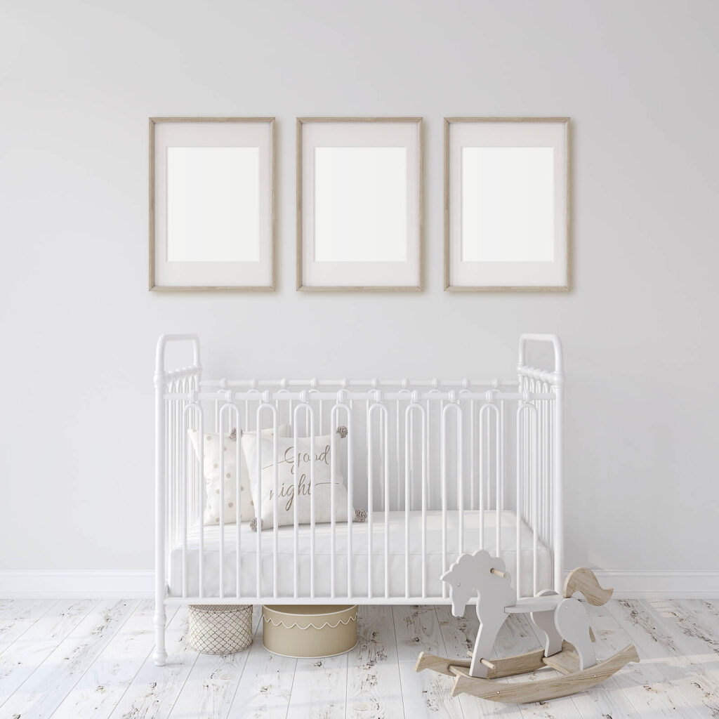 A white crib in a nursery with infant decorations. Postpartum OCD therapy in American Fork, UT is available for your support. Contact our OCD therapists today!