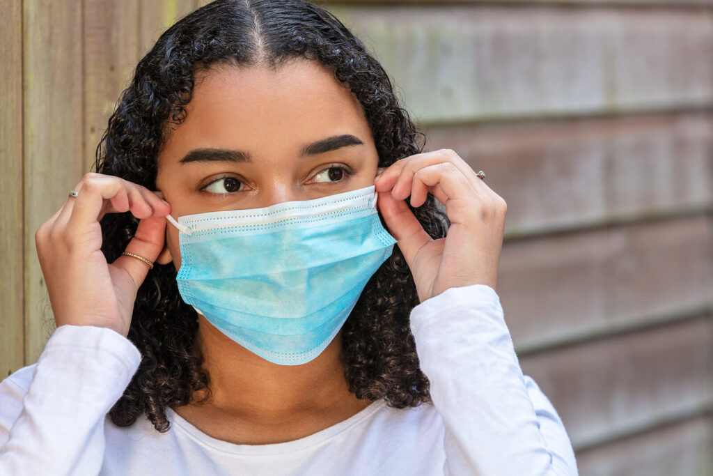 A teen girl adjusts their mask while looking off into the distance. Learn how anxiety treatment in American Fork, UT can offer support with teenage anxiety treatment in American Fork, UT and other services. Search for anxiety treatment for teens American Fork, UT for more support.
