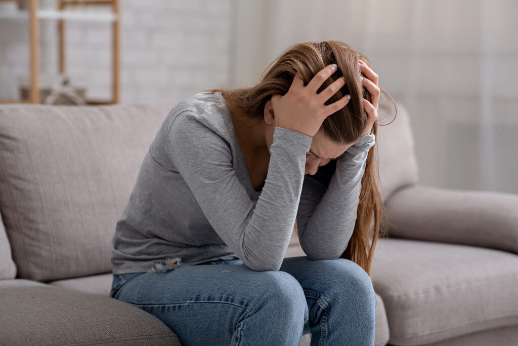 A stressed teen bows their head while holding it in her hands. Learn how therapy for teens in American Fork, UT can offer support for your teens anxiety. Search for anxiety and depression therapists in American Fork by searching for anxiety counseling american fork, ut today.

