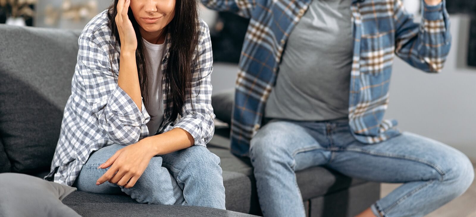 A couple sit on a sofa while having an argument about something. Learn how couples counseling in American Fork, UT can offer support with communication issues. Search for couples communciation therapy American Fork, UT to get in contact with a therapist for couples American Fork, UT today.