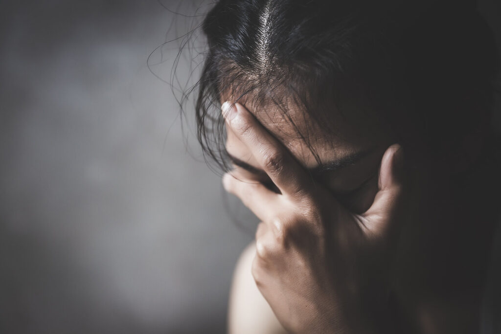 A close up of a woman covering her face with a stressed expression. This could represent the isolation adults can feel due to depression. Search for how anxiety and depression therapists in American Fork can offer support by searching for therapy for depression in American Fork, UT today. Contact depression therapists in American Fork, UT for more info!
