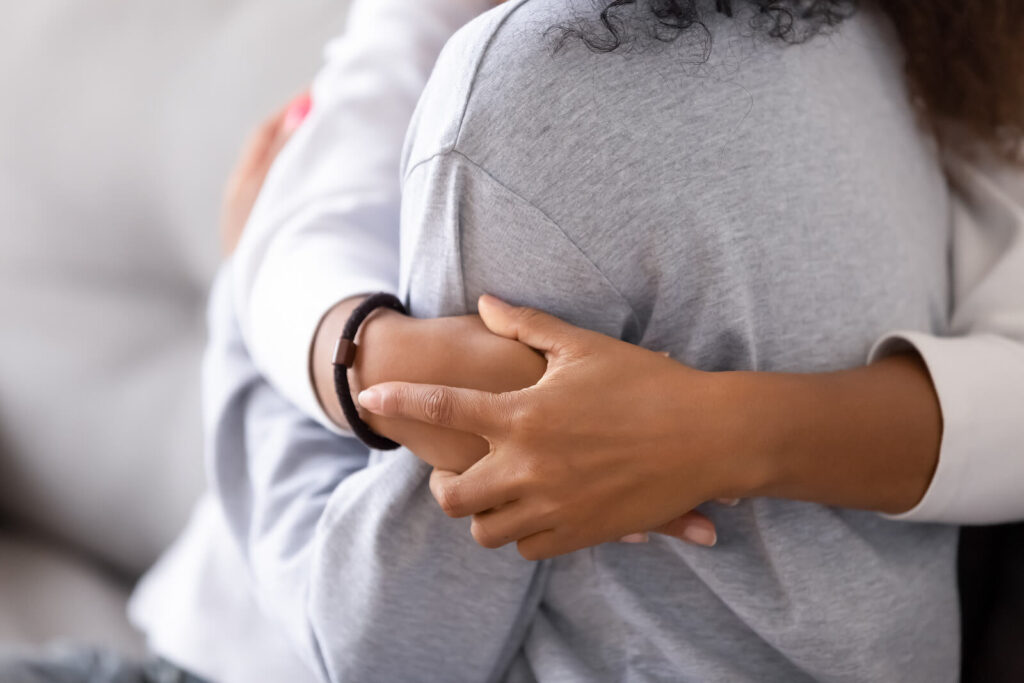 A man covers his face while sitting on a couch. learn how a therapist American fork can help address mental health concerns. Search for depression counseling in American Fork, UT and how an anxiety therapist American Fork, UT can help today.