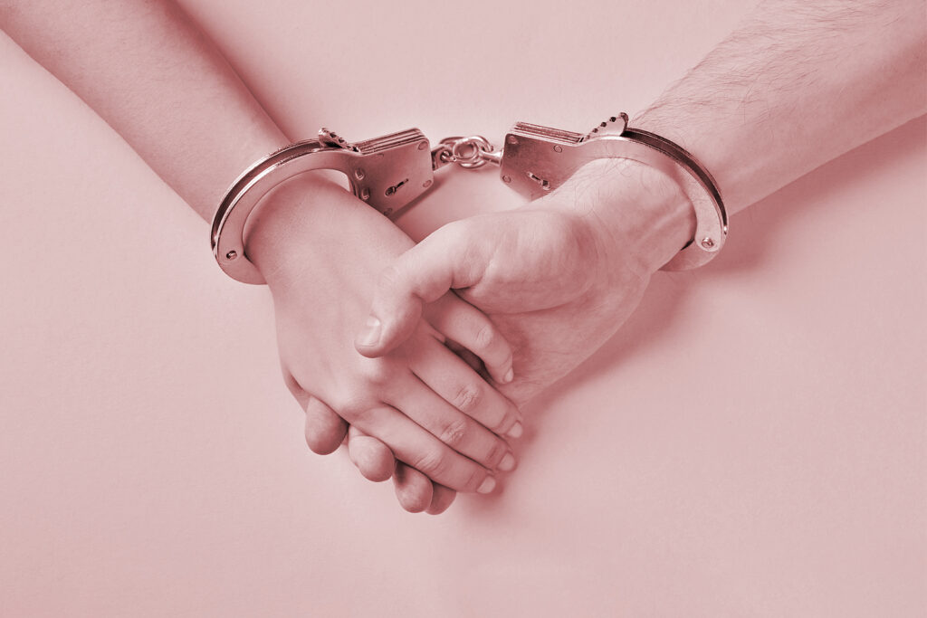 Two hands clasped together, both restrained by a single pair of handcuffs. This could represent the effect of past trauma on relationships that a trauma therapist in American Fork, UT can address. Search for trauma therapy American Fork, UT to learn more about attachment trauma in American Fork, UT and more.
