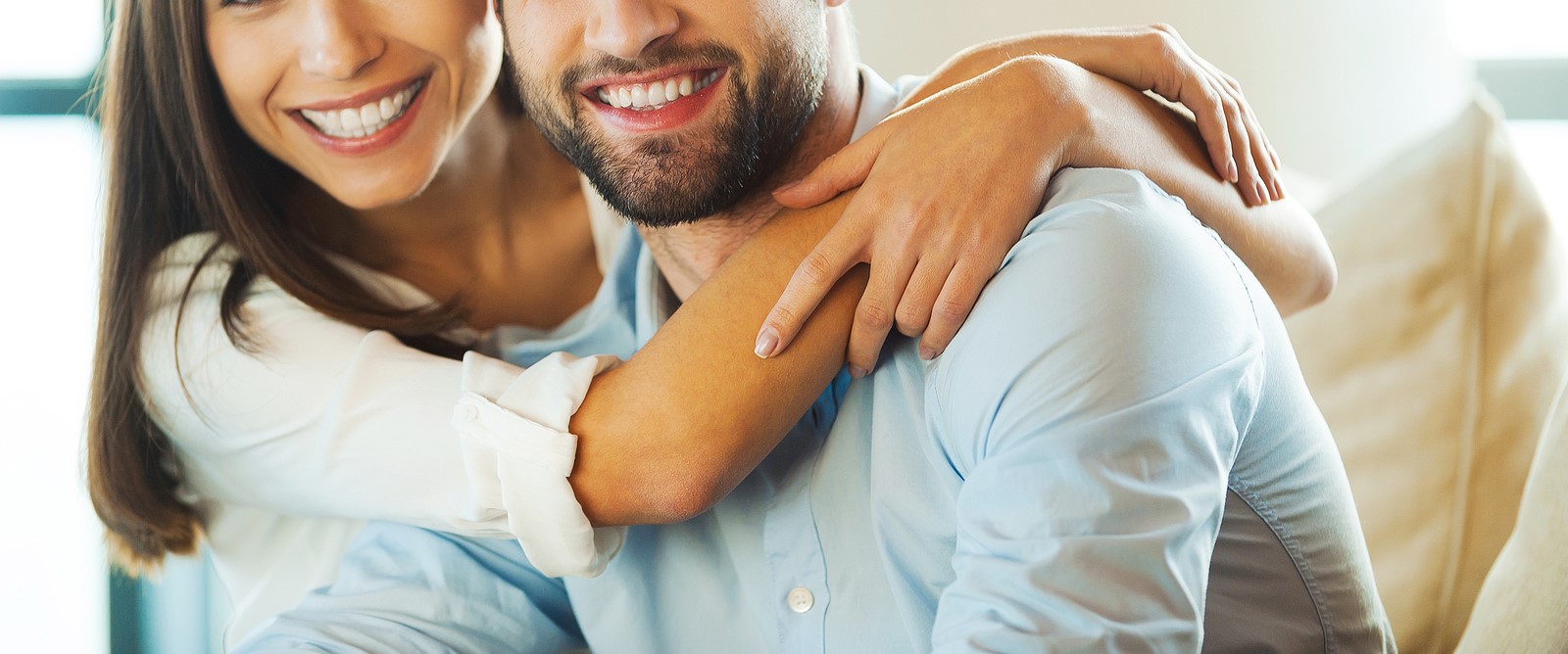 A happy couple smiling together, with the woman embracing the man from behind. Contact a marriage counselor in American Fork, UT to learn more about the support that marriage counseling American Fork, UT can offer. Search for couples therapy for communication American Fork, UT to learn more.