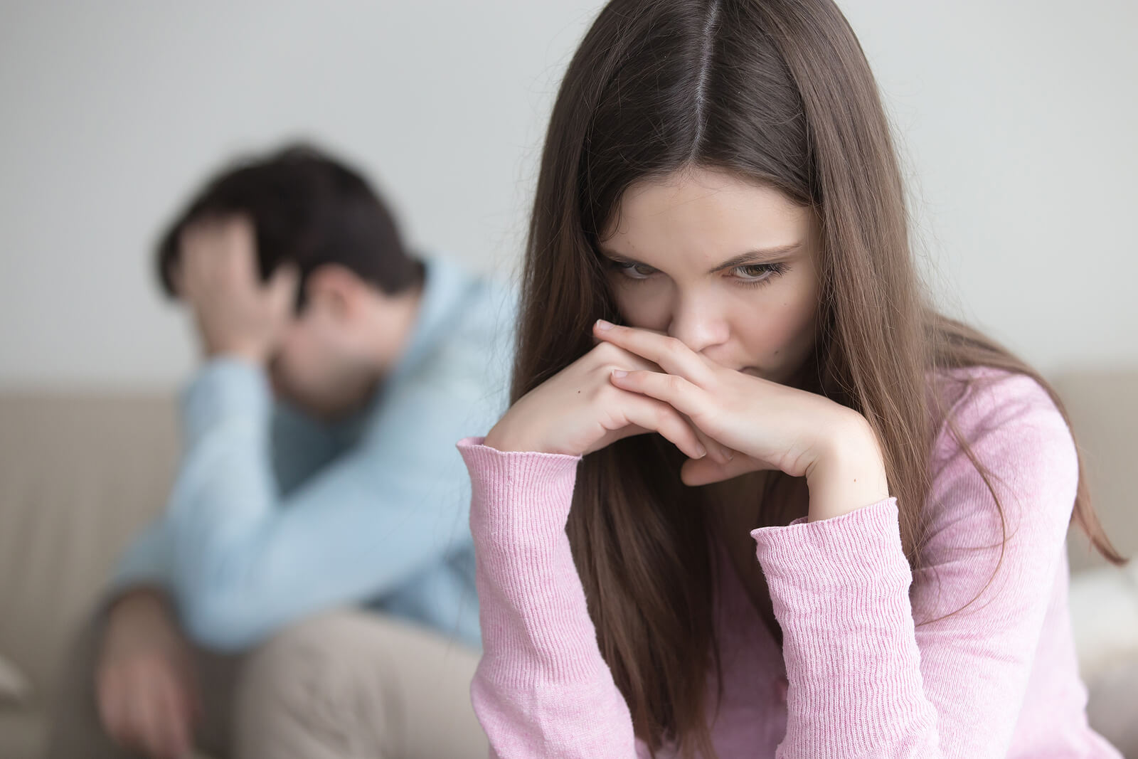 A distressed couple after a conflict, representing the need for couples communication therapy in American Fork, UT and the support available through couples counseling and therapists specializing in attachment trauma.